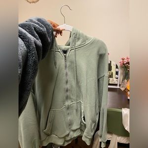 Sage green zip up hoodie.